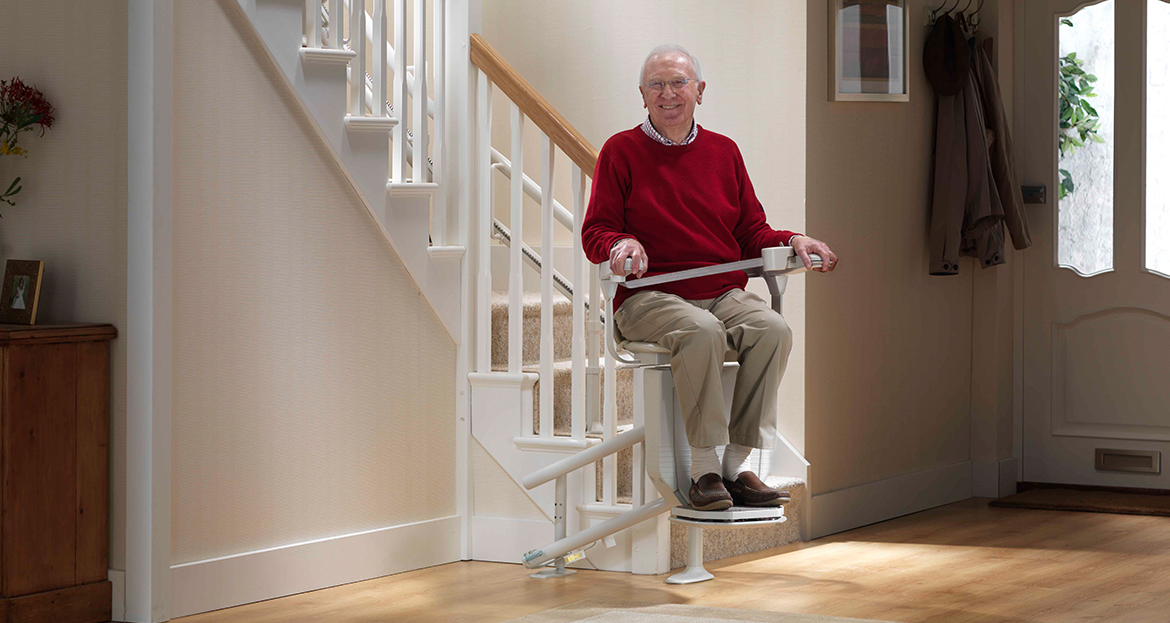 Chair Lift Near Syracuse Ny Image Of Elderly Man Smiling While Using Stair Lift From Syracuse Elevator Company