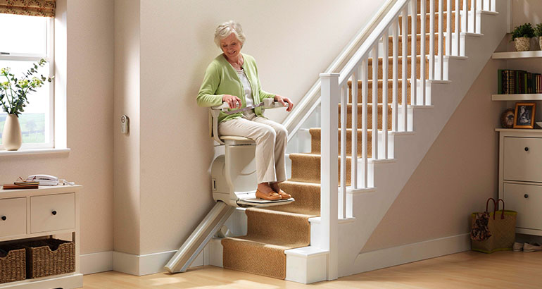 Stairway Lifts Near Syracuse Ny Woman Using Stairway Lift At Home From Syracuse Elevator Company